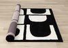 Florence Black White Dynamic Geometric Design, 6'7" x 9'6" Indoor Area Rug | Motif geometrique dynamique noir et blanc Florence, 6'7" x 9'6"